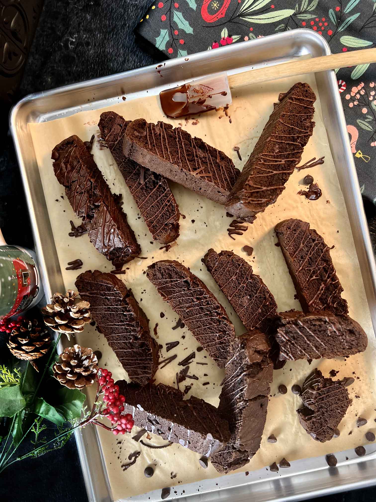 Double Chocolate Cake Mix Biscotti arranged on baking sheet with winter decor